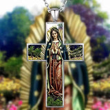 Cross-shaped pendant with religious figure design against a blurred floral background